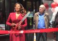 Noëlle Santos cuts the ribbon at the grand opening of Lit. Bar. (Photo courtesy of Eliot Schiaparelli)