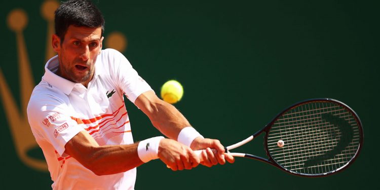 MONTE-CARLO, MONACO - APRIL 19: Novak Djokovic of Serbia plays a backhand against Daniil Medvedev of Russia in their quarter final match during day six of the Rolex Monte-Carlo Masters at Monte-Carlo Country Club on April 19, 2019 in Monte-Carlo, Monaco. (Photo by Clive Brunskill/Getty Images)
