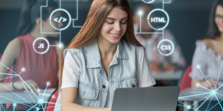 A long-haired woman using a laptop while coding