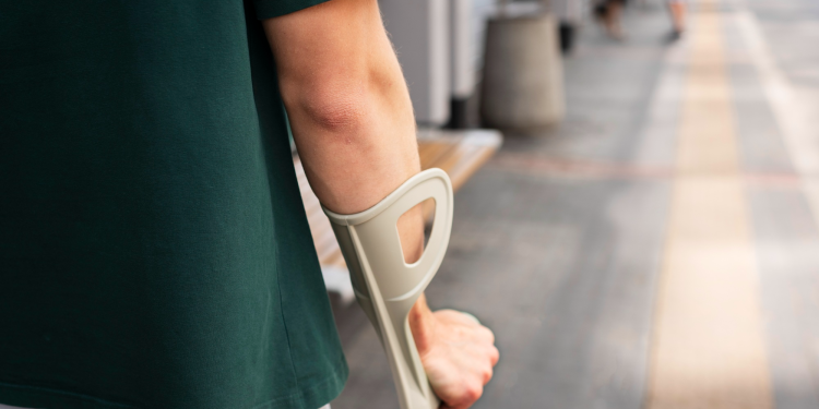 back shot of an injured man walking