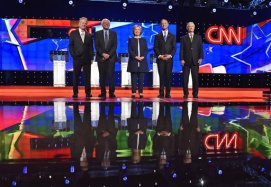 In this Oct. 13, 2015, photo, Democratic presidential candidates from left, former Virginia Sen. Jim Webb, Sen. Bernie Sanders, I-Vt., Hillary Rodham Clinton, former Maryland Gov. Martin O'Malley, and former Rhode Island Gov. Lincoln Chafee take the stage before the CNN Democratic presidential debate in Las Vegas. Democratic presidential candidates gave a meaningful public nod to the Black Lives Matter movement in their first televised debate. The candidates invoked its slogan and raised the core concerns stemming from police killings of African-Americans. Protesters have articulated those concerns in disrupting some of the candidates campaign events.  (AP Photo/David Becker)