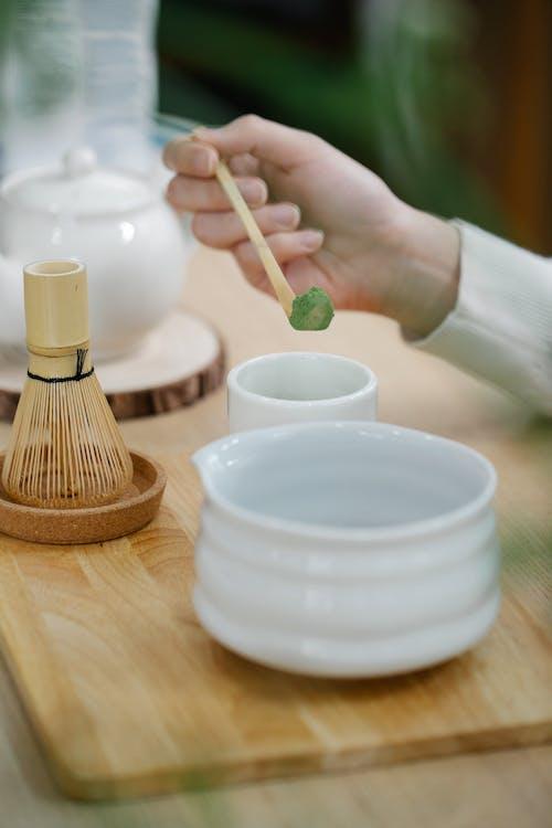 Free Person Holding a Wooden Spoon Stock Photo