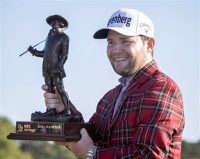 Branden Grace, of South Africa, holds the RBC Championship trophy after winning the final round of the RBC Heritage golf tournament in Hilton Head Island, S.C., Sunday, April 17, 2016. (AP Photo/Stephen B. Morton)