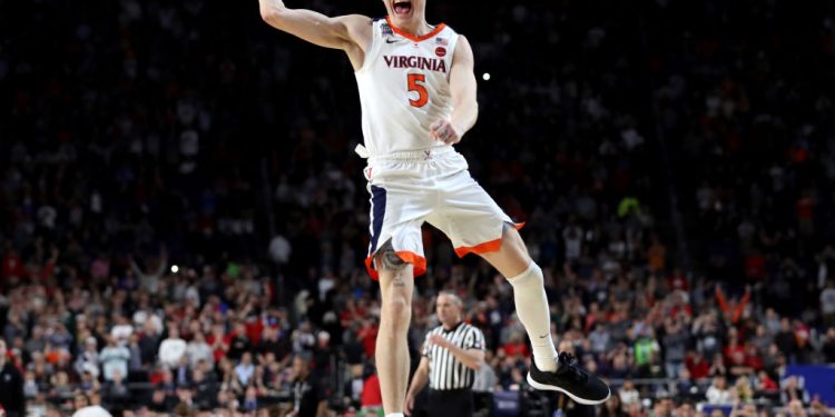 MINNEAPOLIS, MINNESOTA - APRIL 08:  Kyle Guy #5 of the Virginia Cavaliers celebrate his teams 85-77 win over the Texas Tech Red Raiders to win the the 2019 NCAA men's Final Four National Championship game at U.S. Bank Stadium on April 08, 2019 in Minneapolis, Minnesota. (Photo by Streeter Lecka/Getty Images)