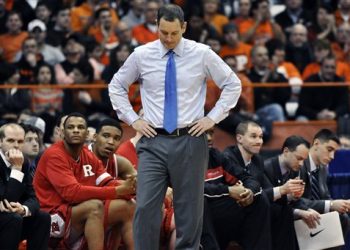 FILE - In this Jan. 2, 2013 file photo, Rutgers head coach Mike Rice reacts after Syracuse scored late in the second half of an NCAA college basketball game in Syracuse, N.Y. Rutgers has fired Rice after a videotape aired showing him shoving, grabbing and throwing balls at players in practice and using gay slurs during practice. With mounting criticism on a state and national level, the school decided to take action on Wednesday, April 3, 2013. relieving Rice of his duties after three largely unsuccessful seasons at the Big East school. (AP Photo/Kevin Rivoli, File)