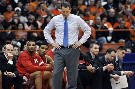 FILE - In this Jan. 2, 2013 file photo, Rutgers head coach Mike Rice reacts after Syracuse scored late in the second half of an NCAA college basketball game in Syracuse, N.Y. Rutgers has fired Rice after a videotape aired showing him shoving, grabbing and throwing balls at players in practice and using gay slurs during practice. With mounting criticism on a state and national level, the school decided to take action on Wednesday, April 3, 2013. relieving Rice of his duties after three largely unsuccessful seasons at the Big East school. (AP Photo/Kevin Rivoli, File)