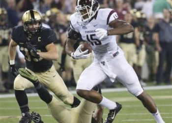 Fordham tight end Phazahn Odom (15) runs from Army linebacker Jeremy Timpf (39) during the first half of an NCAA college football game Friday, Sept. 4, 2015, in West Point, N.Y. (AP Photo/Mike Groll)