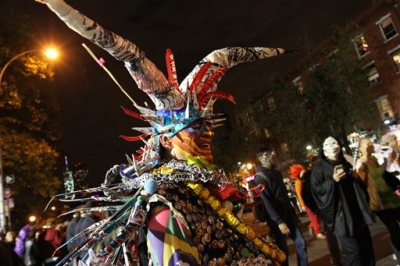 CORRECTS FIRST NAME TO ROLANDO - Dressed as Mr. Halloween, Rolando Vega takes part in the Village Halloween Parade in New York Friday Oct. 31, 2014. (AP Photo/Tina Fineberg)