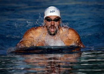 Michael Phelps competes in the 200-meter individual medley final during the Arena Pro Swim Series swim meet, Saturday, April 16, 2016, in Mesa, Ariz. (AP Photo/Matt York)