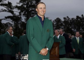 Jordan Spieth poses with his green jacket after winning the Masters golf tournament Sunday, April 12, 2015, in Augusta, Ga. (AP Photo/Matt Slocum)