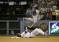 New York Mets shortstop Ruben Tejada, goes over the top of Los Angeles Dodgers' Chase Utley who broke up a double play during the seventh inning in Game 2 of baseball's National League Division Series, Saturday, Oct. 10, 2015 in Los Angeles. (AP Photo/Gregory Bull)